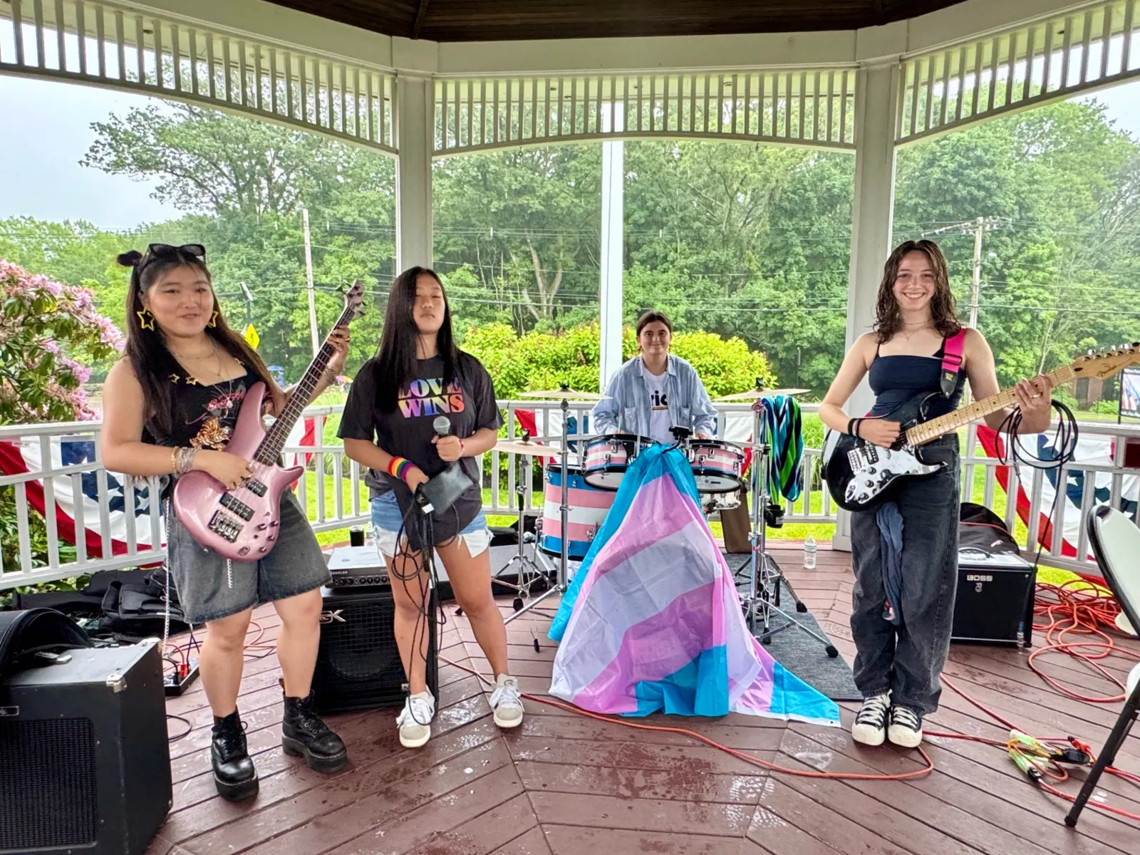 Student band performing at a gazebo with instruments